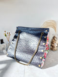 Black textured leather button cube bag - daisies
