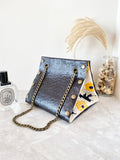 Black textured leather button cube bag - sunflowers