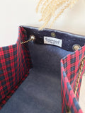 Black textured leather button cube bag - red plaid