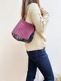 Black textured leather button cube bag - red plaid