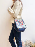 Blue leather button cube bag - blue floral