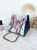 Blue leather button cube bag - blue floral