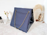 Black textured leather button cube bag - geometric star print