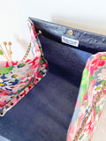 Black textured leather button cube bag - daisies