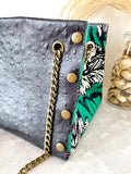 Black textured leather button cube bag - green floral sketch