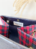Black textured leather button cube bag - red plaid
