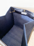 Black textured leather button cube bag - blue denim