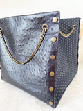 Black textured leather button cube bag - geometric star print