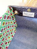 Black textured leather button cube bag - green flower tiles