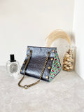 Black textured leather button cube bag - green flower tiles