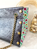 Black textured leather button cube bag - green flower tiles