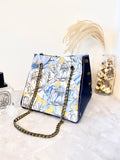 Blue leather button cube bag - lotus flowers