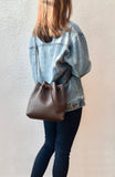 Brown bucket bag with yellow floral lining