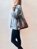 Brown bucket bag with yellow floral lining