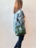 Green leather bucket bag with chevron lining