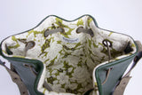 Green leather bucket bag with floral lining