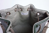 Green leather bucket bag with chevron lining