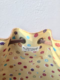 Brown bucket bag with yellow floral lining