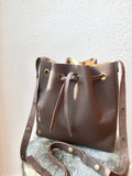 Brown bucket bag with yellow floral lining