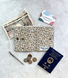 Short travel wallet with customisable leather name tag