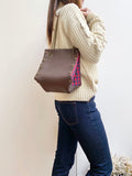Brown leather button cube bag - red plaid