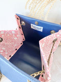 Blue leather button cube bag - red lace