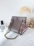 Brown leather button cube bag - red blue checkers
