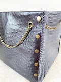 Black textured leather button cube bag - mini dotted eyes