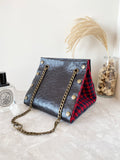 Black textured leather button cube bag - red plaid