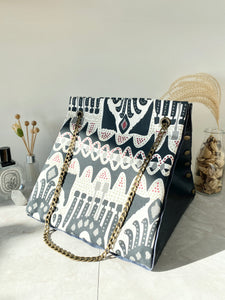 Black textured leather button cube bag - ikat print