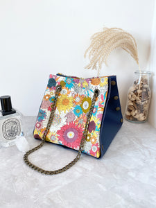 Blue leather button cube bag - yellow sunflowers